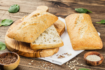 multigrain Ciabatta bread on wooden background