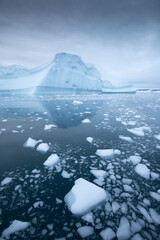 Melting of a iceberg and pouring water into the sea by the coast of Greenland
Greenland and amazing...