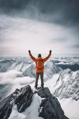 Tuinposter On top of the world concept with man in orange jacket standing on mountain top, Generative AI illustration © IBEX.Media