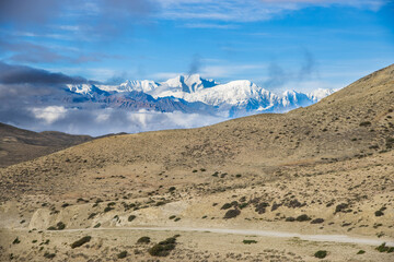 Foggy Himalayan Mountain and Desert of Upper Mustang in Nepal as seen from Lho La Pass