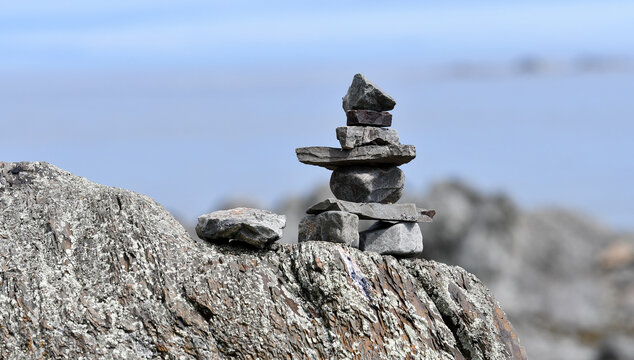 View of an inukshuk in the picturesque Bic Park (Parc national du Bic). Parc national du Bic is located in the Bas-Saint-Laurent tourism region near Rimouski. Quebec Province, Canada.