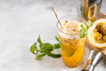 Refreshing passion fruit drink with mint and vodka.