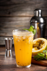 Refreshing passion fruit drink with mint and vodka.