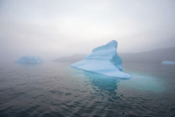 Melting of a iceberg and pouring water into the sea by the coast of Greenland
Greenland and amazing...