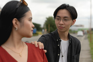 A kind and empathetic man reassuring his suspicious and upset girlfriend everything will be...