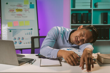 Young Asian businessman talking on the phone
late night hustle ambitious Working overtime talking...