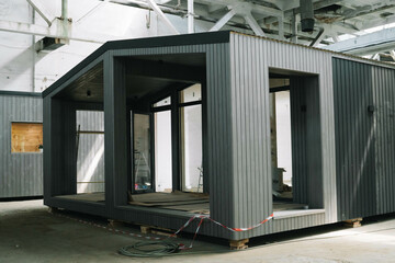 A new wooden modular prefabricated house inside in manufacturing facility