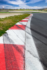 Motor sport curbs and skid marks close up on motor sport racetrack
