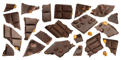 Slices of dark chocolate with nuts on a white isolated background. A set of chocolate that scatters...