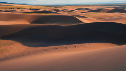 desert with cloudy sky during sunset