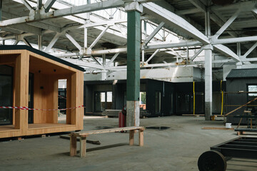Fototapeta premium Modular apartment house of frame type in construction site. Mobile eco-friendly space for living and tourism