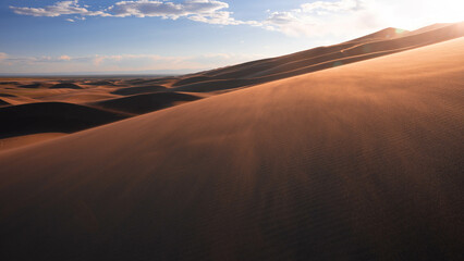 desert with cloudy sky during sunset