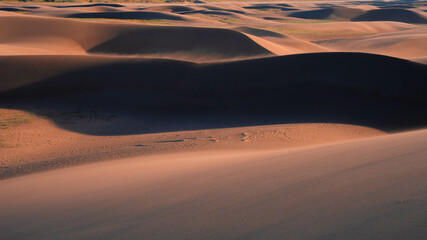 desert with cloudy sky during sunset