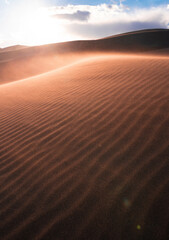 desert with cloudy sky during sunset