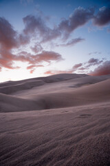 Fototapeta na wymiar desert with cloudy sky during sunset