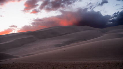 desert with cloudy sky during sunset