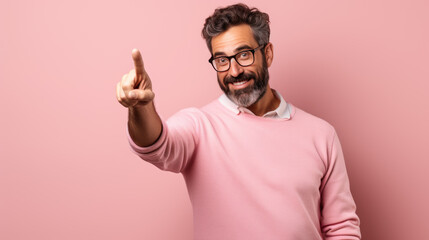 Naklejka premium Middle aged man wearing casual clothes pointing with hand and finger to the side looking at the camera.