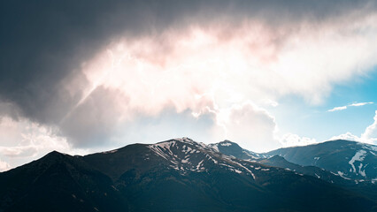 sunset in the mountains with cloudy sky