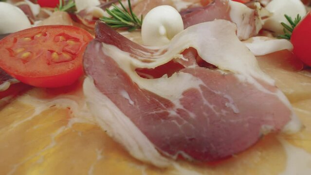 Cured raw ham. Slices of dried pork jamon, close-up view