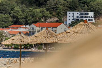 Sunshade straw umbrella on the beach

