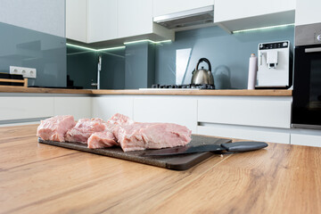 Preparing pork meat on the kitchen