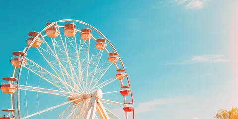 Deurstickers Attraction in amusement parks - Ferris wheel against bright blue sky, copy space for text. Creative minimal wallpaper for open-air amusement park. © dinastya