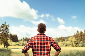 Naklejka na ściany i meble Solitary person enjoying peace and quiet surrounded my beautiful nature setting 