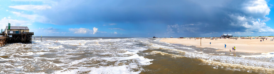 Sunshine again after a heavy sandstorm on the beach of Sankt Peter Ording, North Sea, Germany