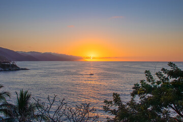 Fototapeta na wymiar A beautiful sunset by the ocean in Mismaloya Puerto Vallarta south coast