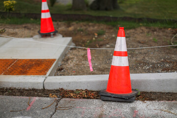 construction cones line streets, embodying urban evolution, progress, caution, and temporary...