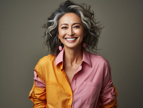 Portrait of a Smiling Asian Business Woman middle age 50s 40s with natural makeup clean face, colorful clothes, isolated, png
