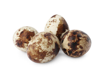 Beautiful speckled quail eggs on white background