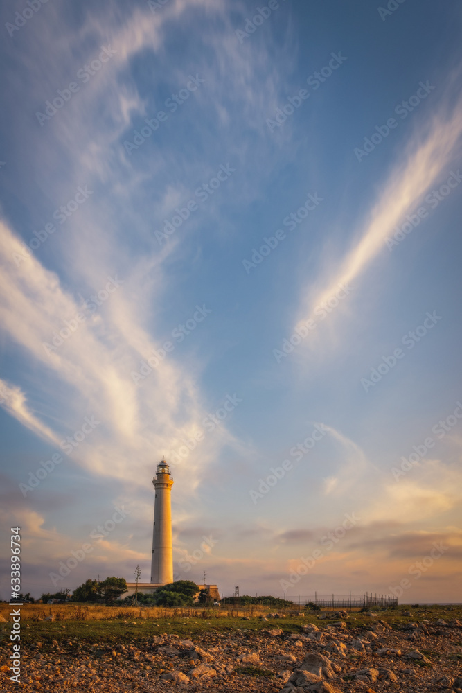 Wall mural Lighthouse of San Vito Lo Capo at sunrise time with beautiful clouds. Sicily island, Italy. Popular travel destination. June 2023 - Wall murals
