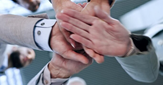 Stack, teamwork or hands of business people for motivation for mission, collaboration or support. Partnership, low angle closeup or colleagues in meeting huddle with vision or solidarity together