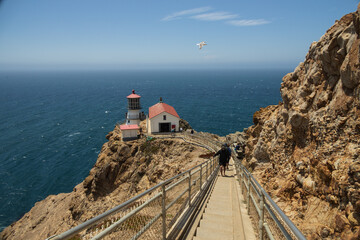 Tourist climbing stairs to Point Reyes Lighthouse at Point Reyes National Seashore, California
