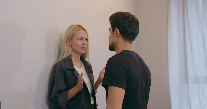 angry blonde woman is arguing with her man and slaps him: jealousy, Slow motion. physical and psychological violence, abuse. Husband shocked after woman slap, family quarrel, uncontrolled aggression