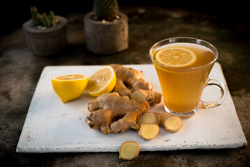 Ginger tea with lemon in a glass