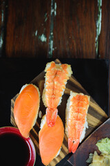 Sushi Set nigiri shrimp and salmon on wood,top view, close up
