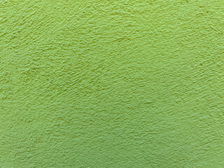Acid green color blank stucco wall background texture