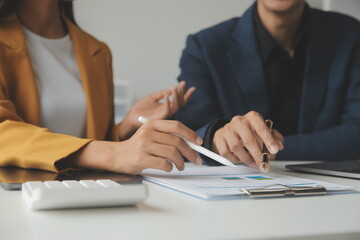 Financial Business team present. Business man hands hold documents with financial statistic stock photo, discussion, and analysis report data the charts and graphs. Finance Financial concept