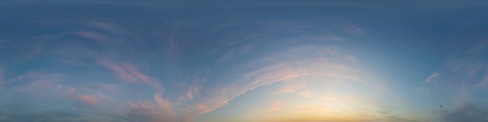 Sunset sky panorama with bright glowing pink Cirrus clouds. Seamless hdr 360 panorama in spherical...