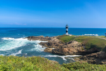 Fototapeta na wymiar The lighthouse at isla Pancha in Galicia
