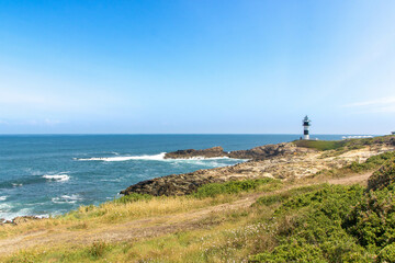 Fototapeta na wymiar The lighthouse at isla Pancha in Galicia