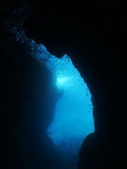 cave diving underwater scuba divers exploring caves and having fun ocean scenery