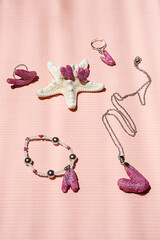 Craft jewelry set heart shaped made of painted coral.