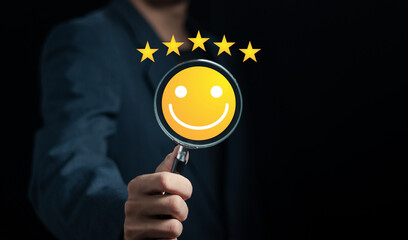 hand holding a magnifying glass with smiley face icon, customer service 5 star satisfaction...
