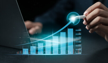 Businessman analyzing growth sales data graph on modern interface icons. digital online marketing Financial and investment business planning and development.