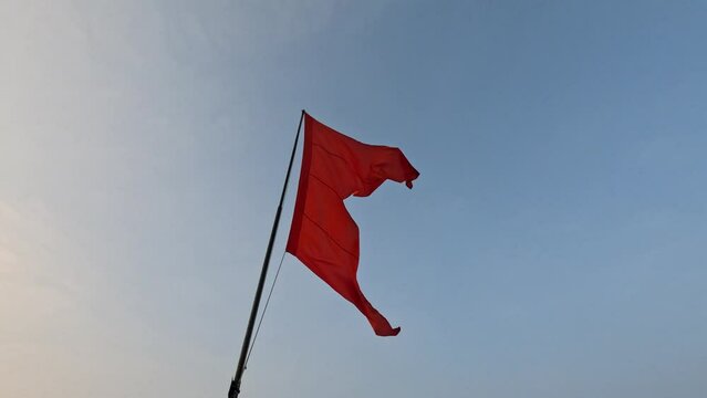 Saffron flag waving or fluttering repersenting Hindu culture