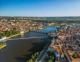 The drone aerial panoramic view of River Vltava runs through Prague city at sunrise, Czech Republic.	