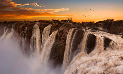 Augrabies water fall, raging water and full color sunsets